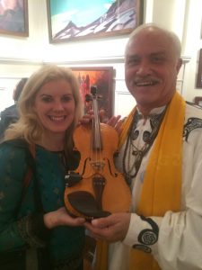 Nell Rose Foreman and Patrick McCollum with the World Peace Violin